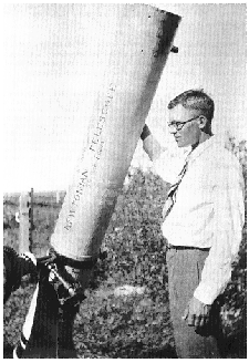 Clyde Tombaugh with telescope