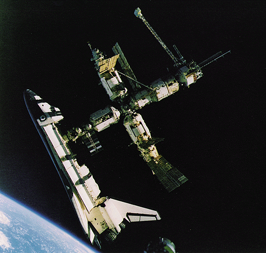 Space shuttle Atlantis docked with Mir